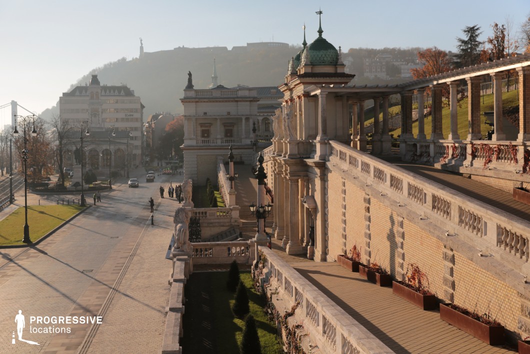 Historic terrace with colonnade and statues, a film and photography location featuring layered walkways and classical design