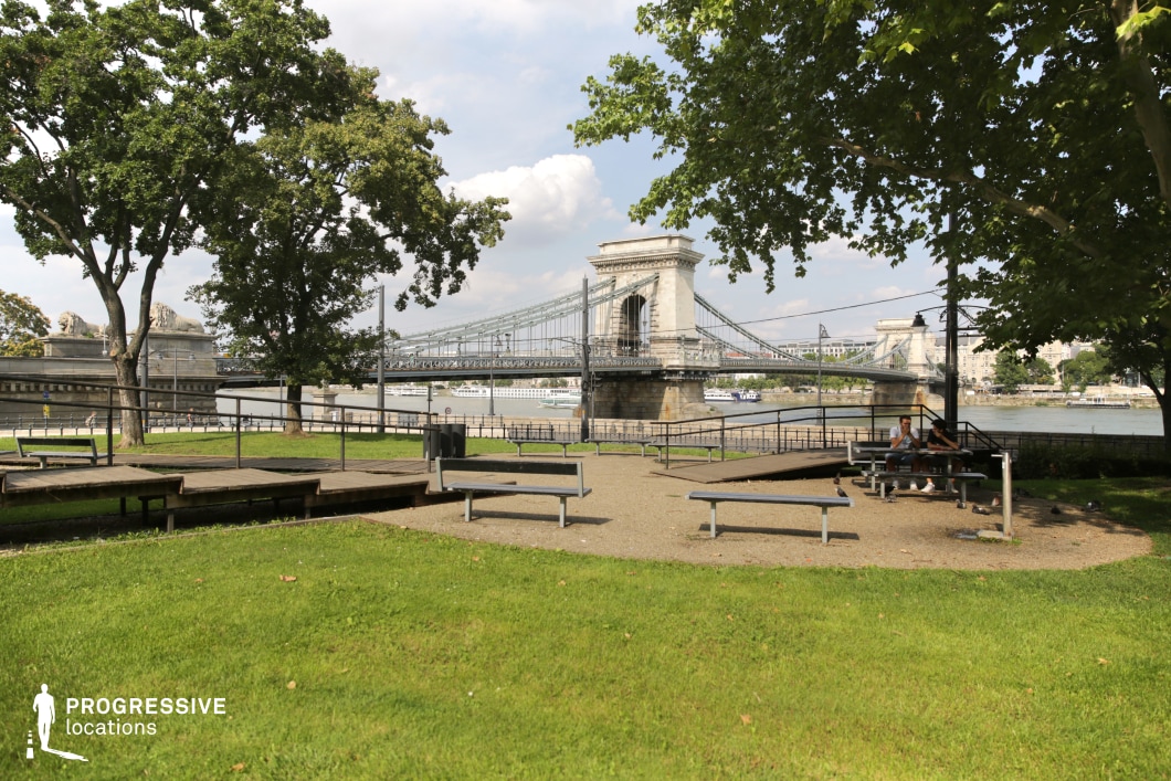 Park with open seating facing bridge used for film and photography location with clear lines and structured background