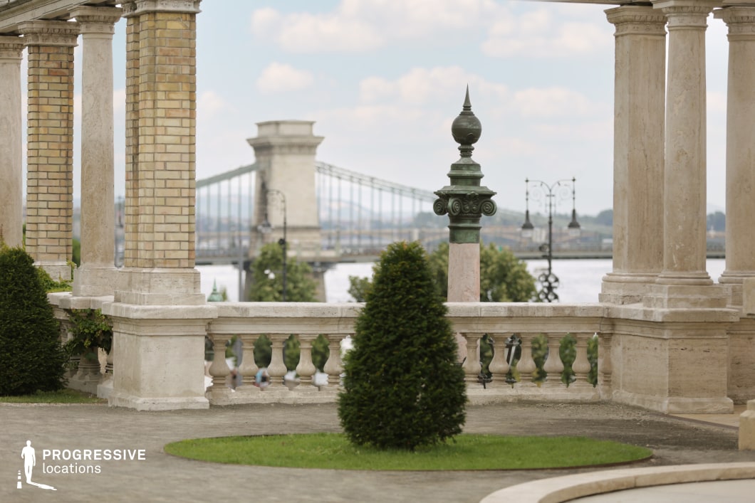 Stone terrace with balustrade overlooking bridge as a shooting location for film and photography with layered perspective