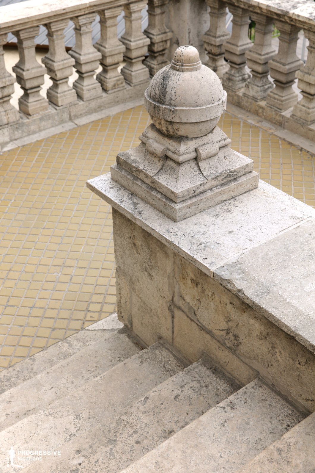 Close view of stone balustrade detail, used for photo and film shoots focusing on texture and architectural craftsmanship