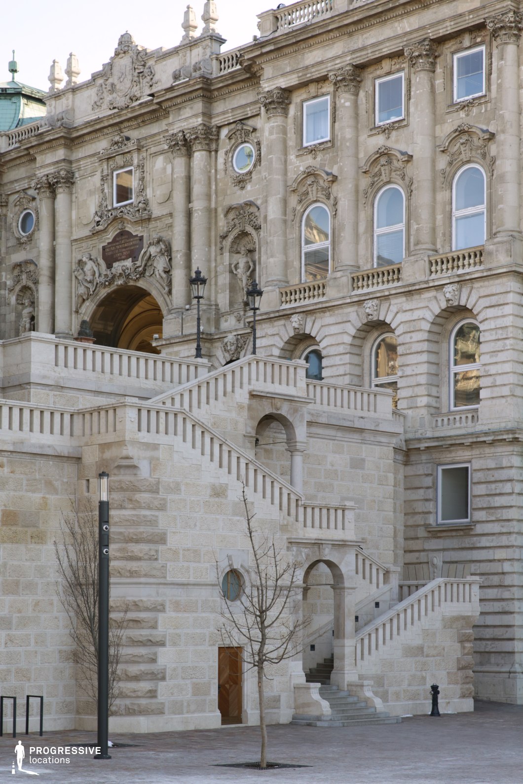 Large exterior staircase with balustrades, ideal location for photography and filming with strong lines and classical architecture