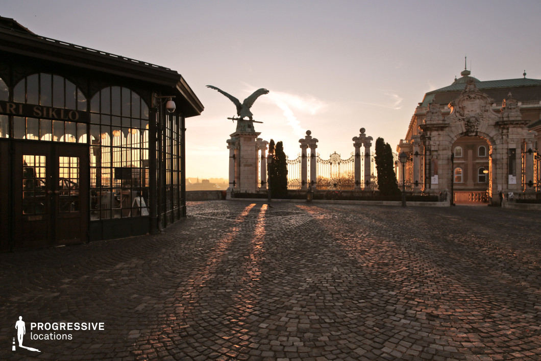Ornate gated courtyard with stone pillars, used for photo and film shoots with symmetrical layout and detailed architecture