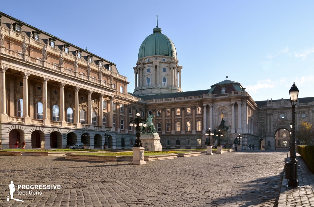 Grand palace courtyard with dome and statues, a film and photography location with expansive space and neoclassical architecture