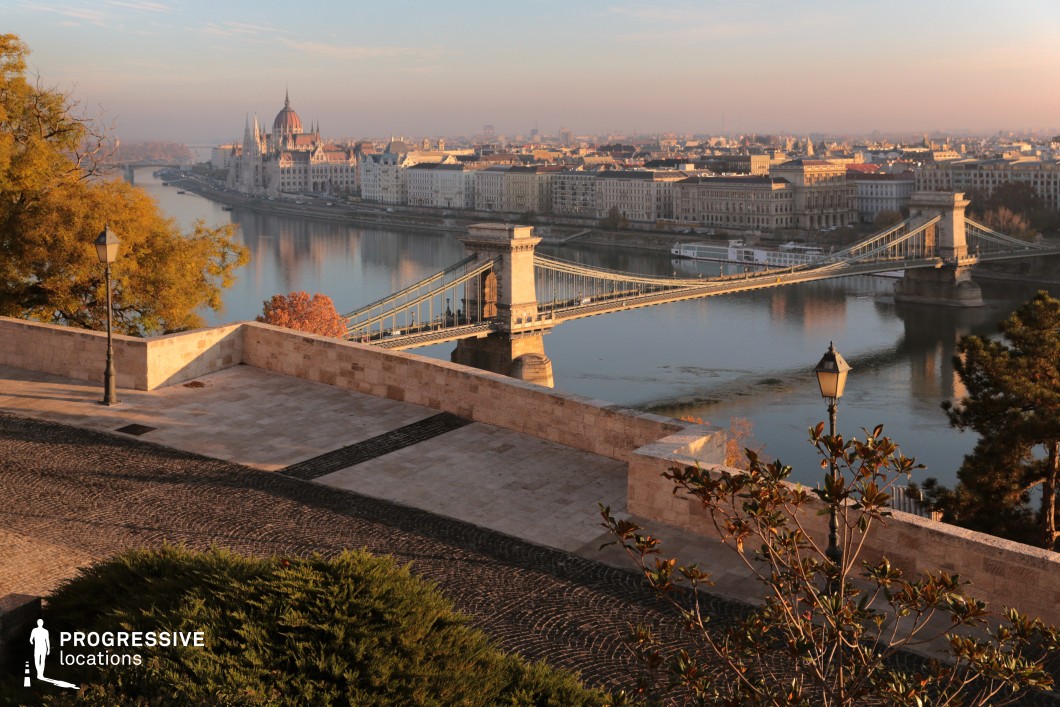 Panoramic river and bridge view from terrace, a film and photography location with layered urban architecture and open composition