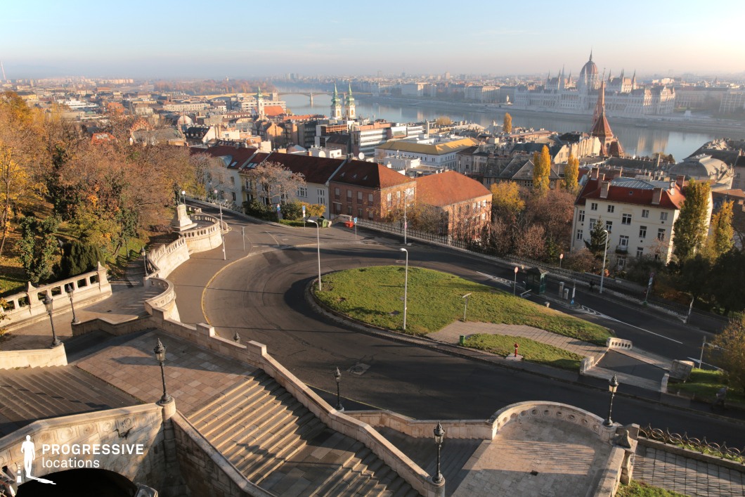 Elevated urban panorama with river and rooftops, ideal film and photography location with layered city depth