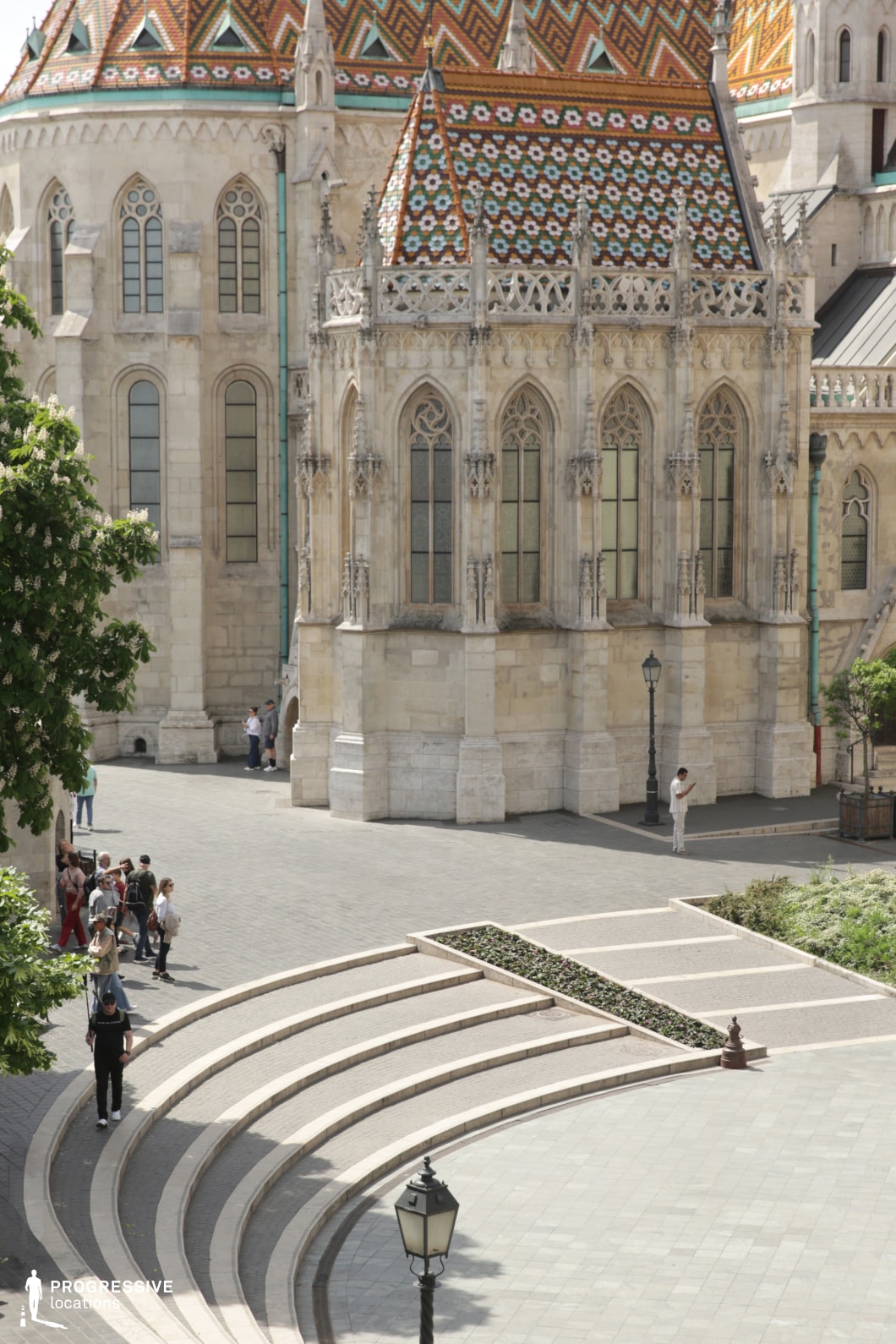 Gothic facade with patterned roof and pointed windows, an ideal location for photography and filming with rich details