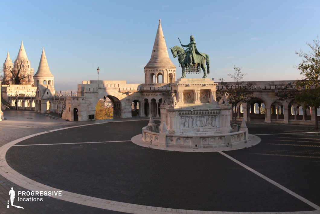 Monumental statue with arcaded terraces, a structured photography and film location with symmetrical stone architecture