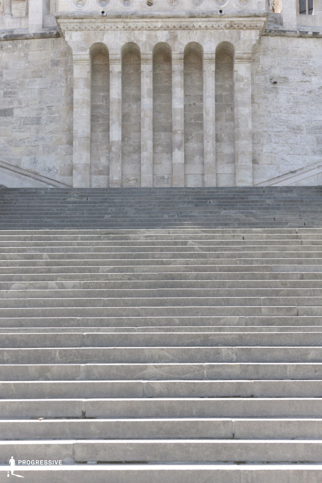 Wide stone staircase and facade, a photography and film location defined by strong horizontal and vertical geometry