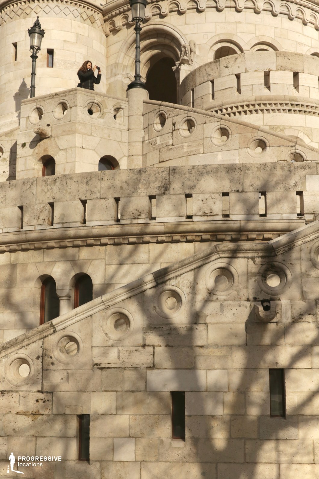 Layered stone terrace with stairs and circular details, shooting location for film and photography projects with strong geometry