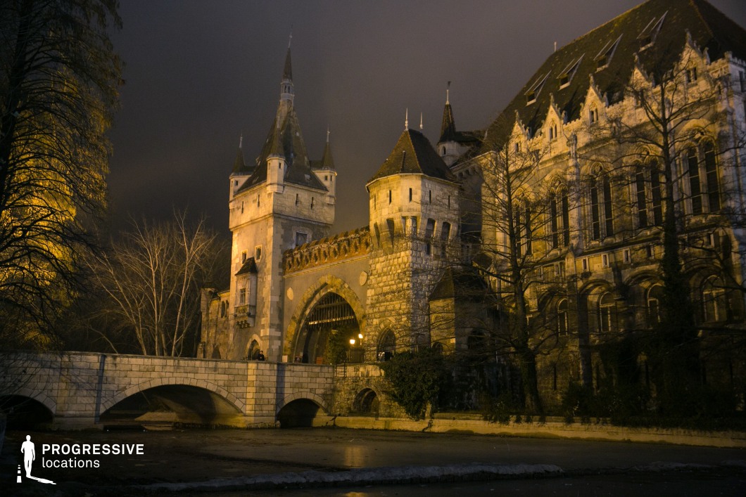 Stone bridge leading to fortified castle gate, a shooting location for film and photography projects with towers and arches