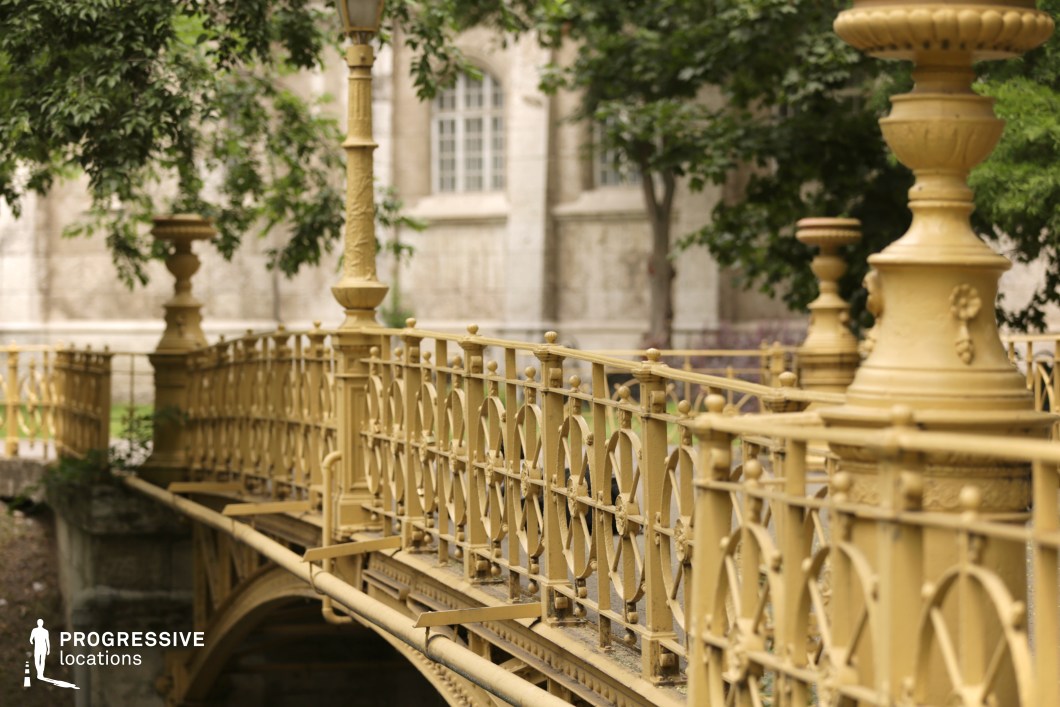 Close view of ornate bridge railings, shooting location for film and photography projects with detailed metal patterns