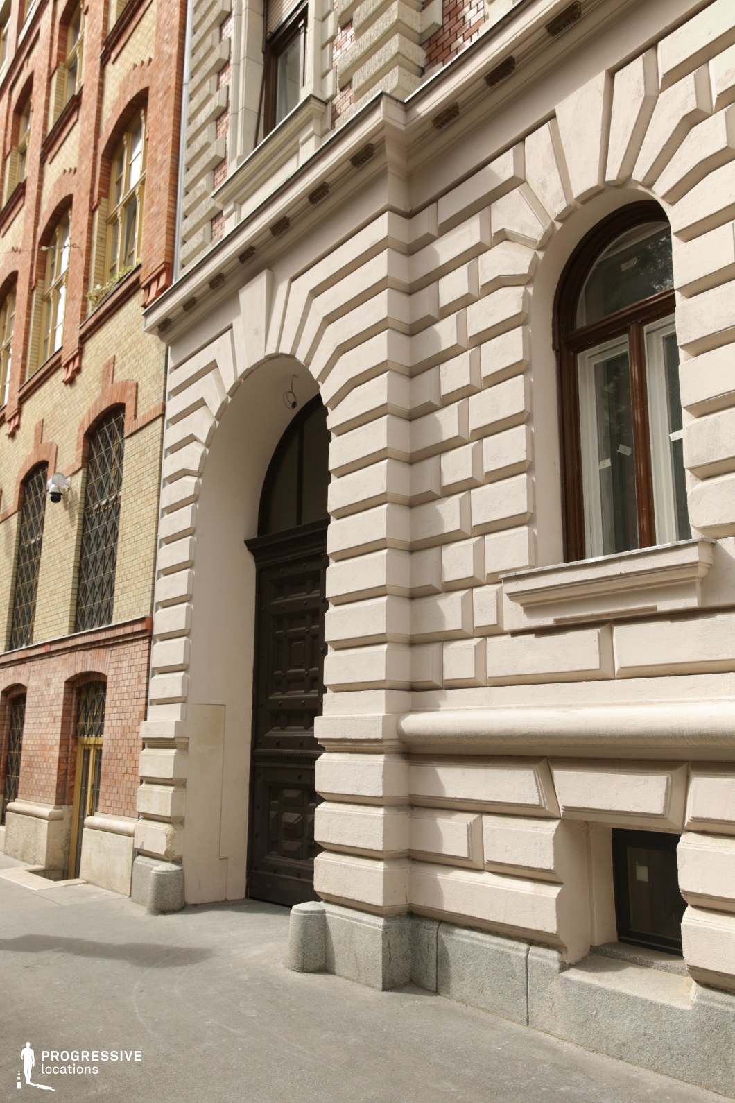 Arched entrance with detailed stone facade creates a photography and film location with strong architectural depth