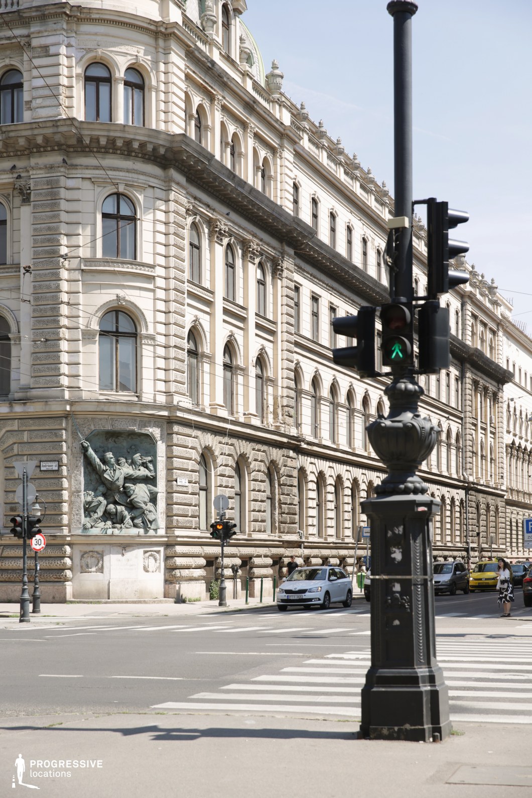 Traffic light in front of classical facade forms a film and photography location with strong foreground and architectural detail