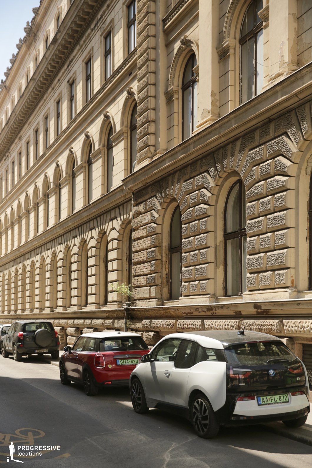 Stone facade street with arched windows creates an ideal location for photography and filming with textured surfaces