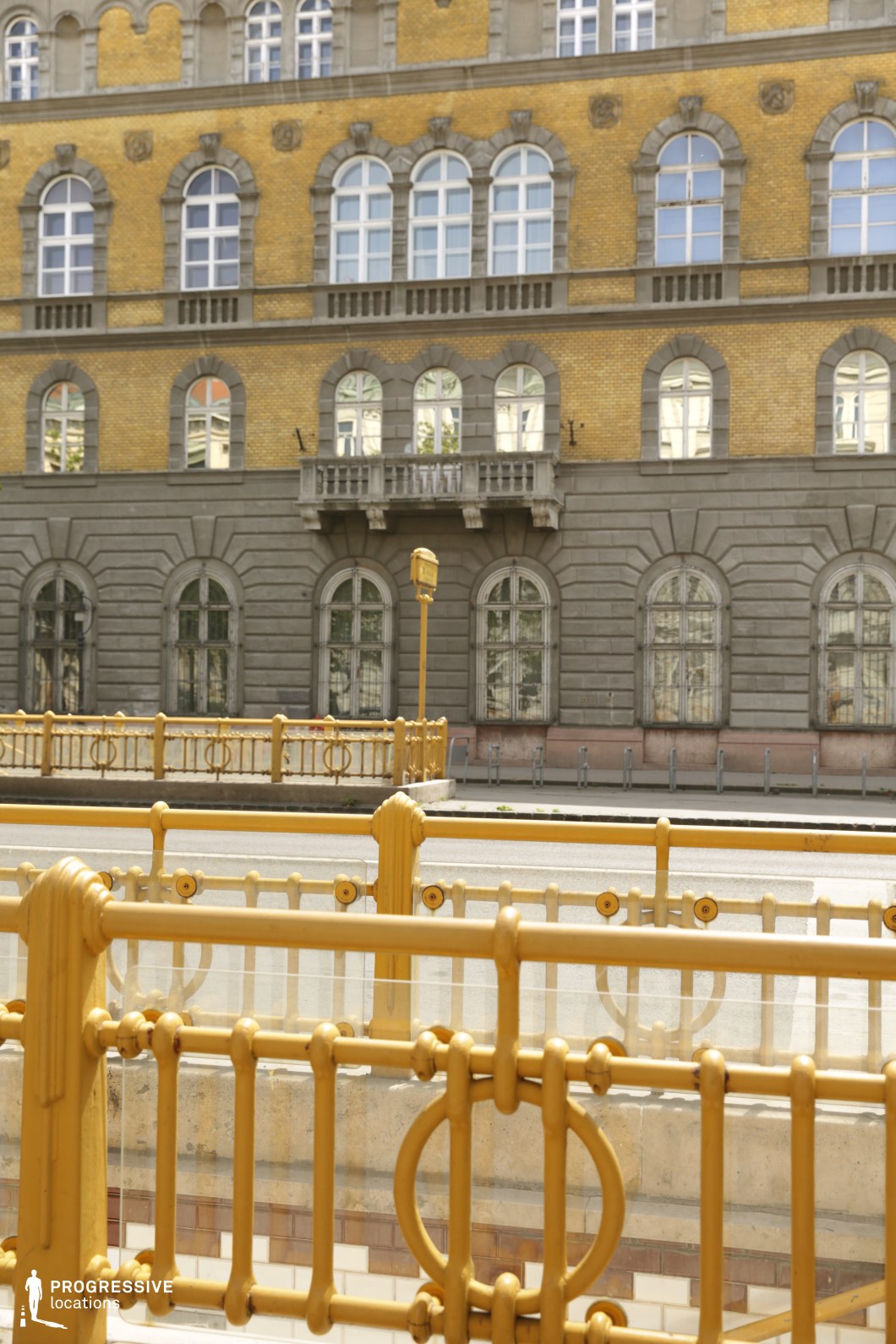 Close view of decorative railings against historic facade offers a film and photography location with geometric detail