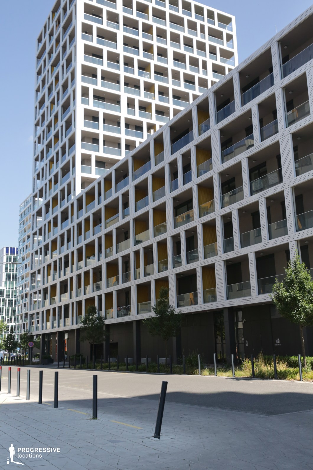 Modern apartment facade with grid balconies, photography and film location with strong geometric pattern