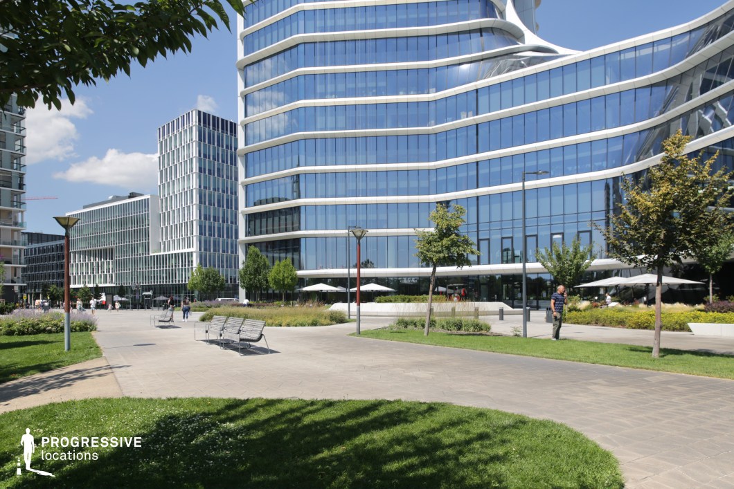 Urban plaza with modern glass offices, available for filming or photo shoots