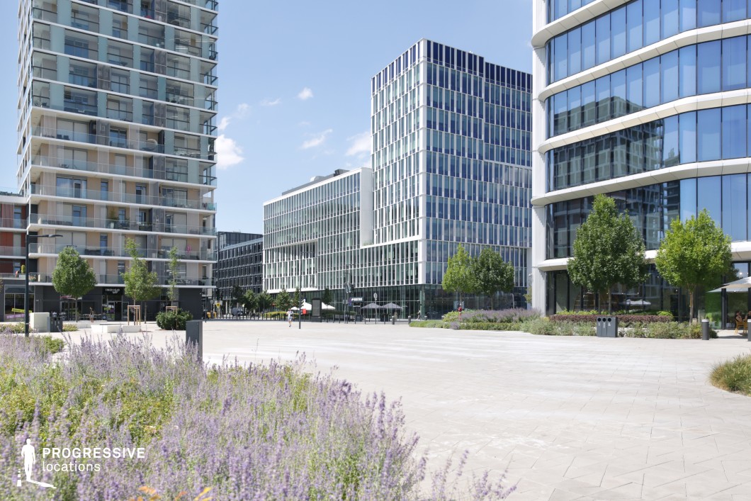 Open urban square with modern buildings, available for filming or photo shoots