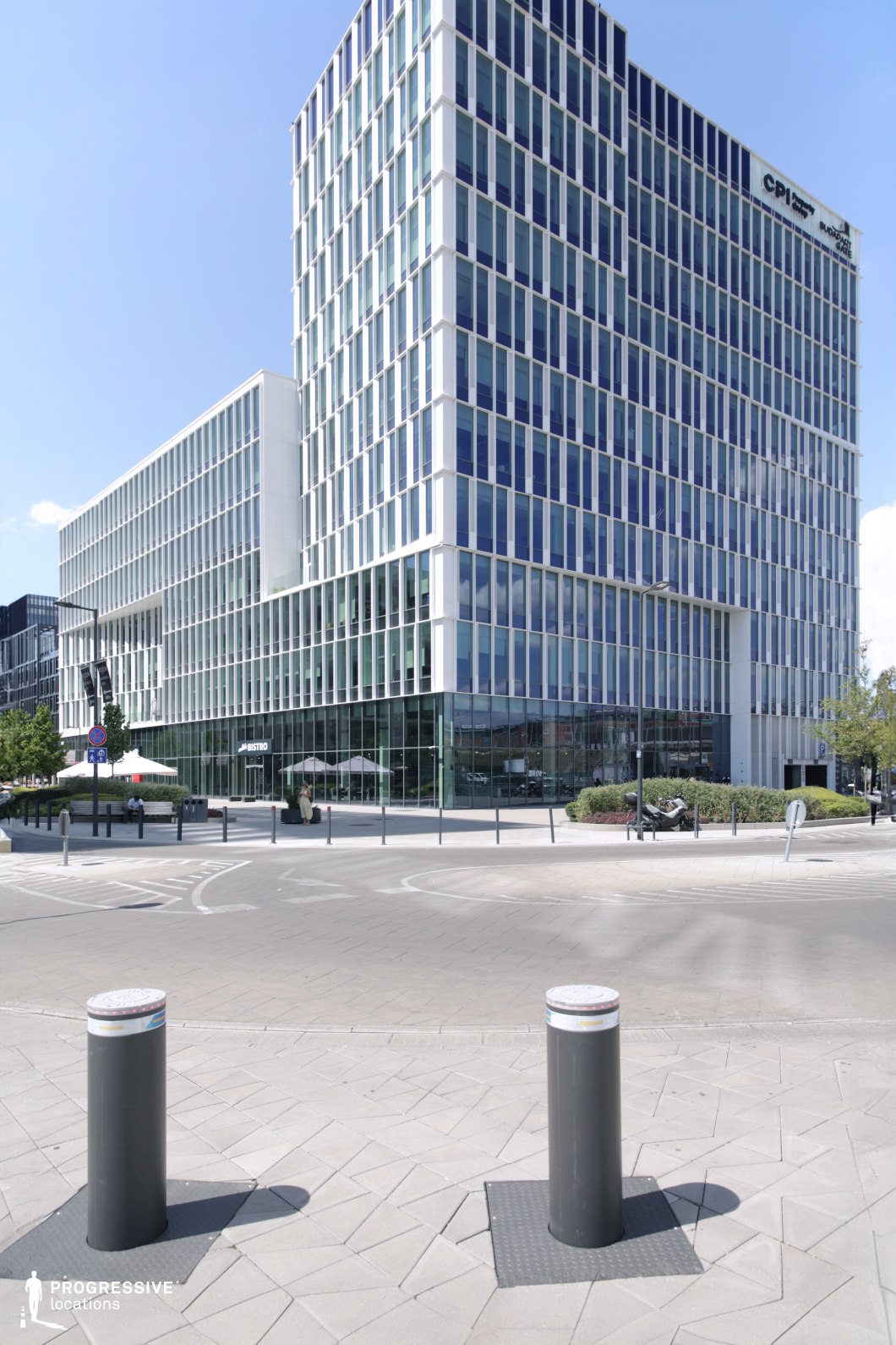 Glass office building exterior, ideal location for photography and filming in urban setting