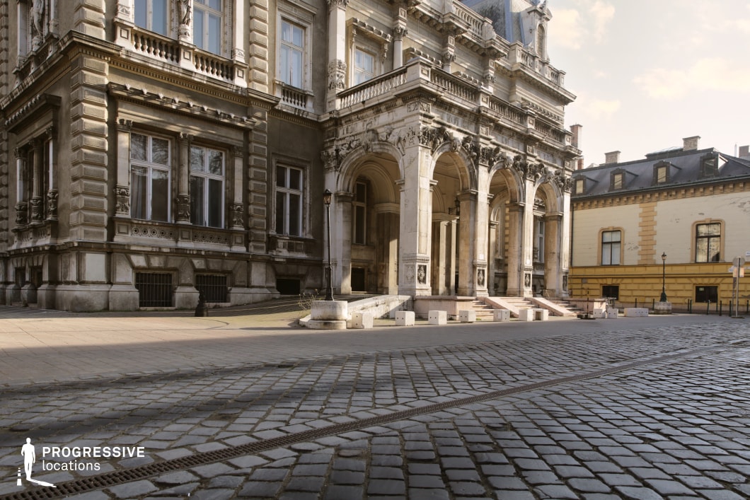 Ornate arched entrance and cobblestone courtyard form an ideal film and photography location with classical architectural depth