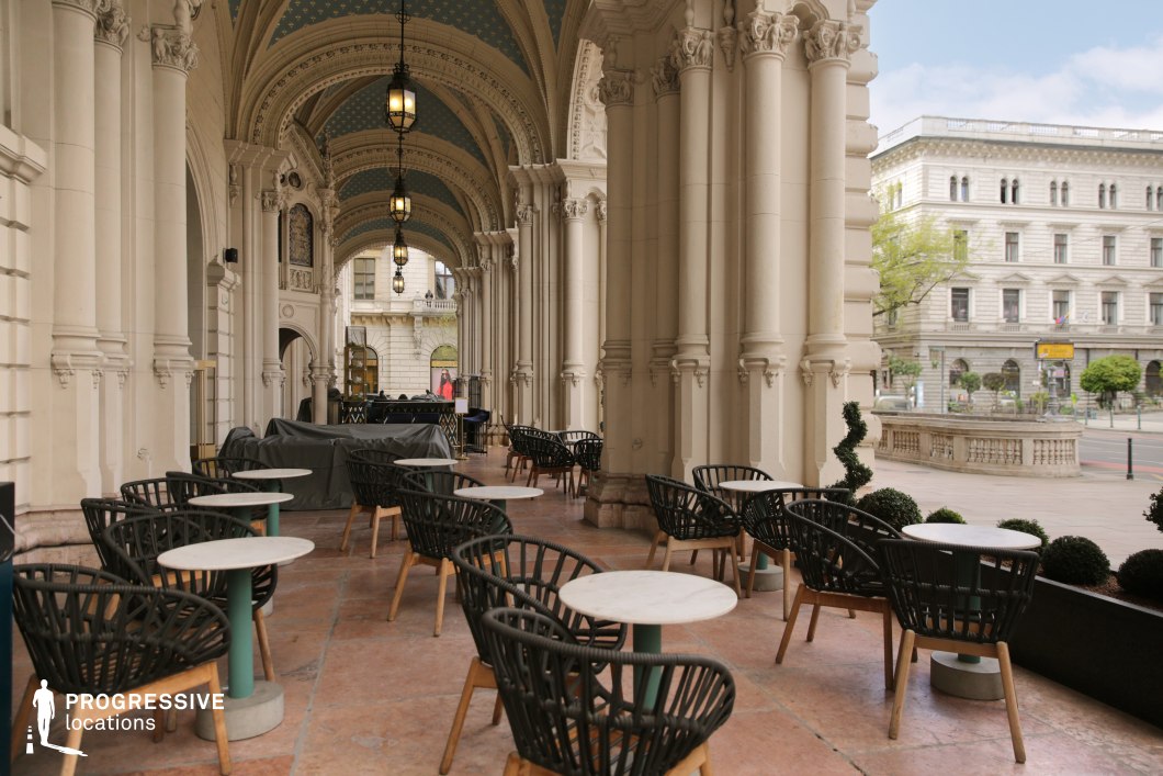 Grand neoclassical arcade terrace used for photo and film shoots within a monumental historic setting.