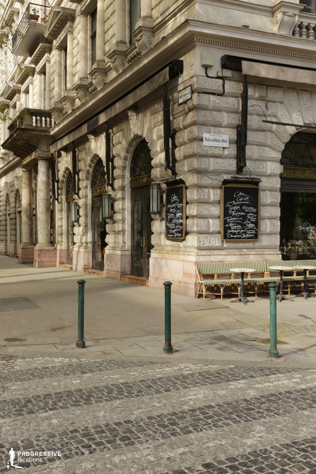 Historic cafe corner with stone facades serves as an ideal location for photography and filming projects.