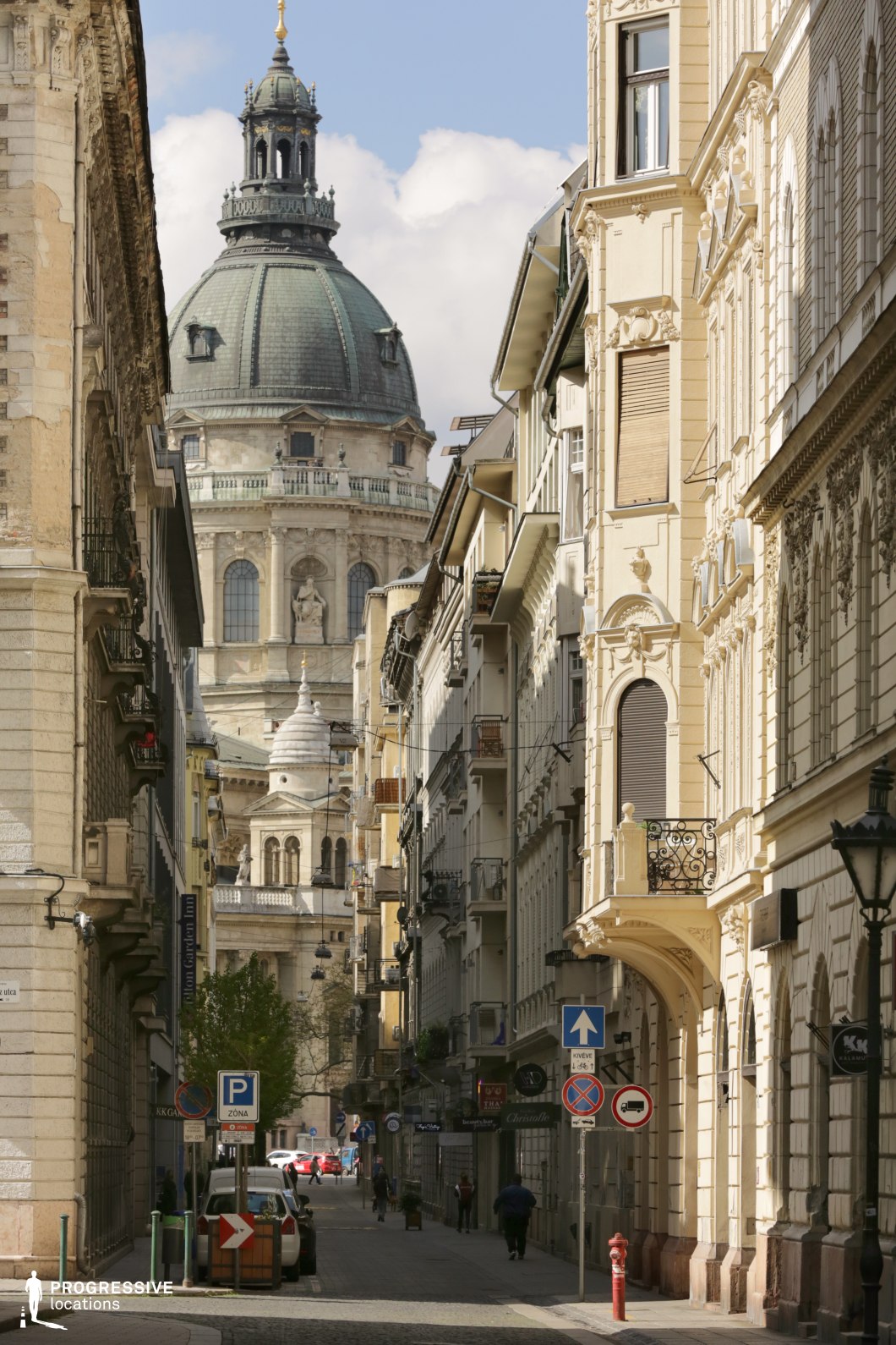 Historic street leading to a domed cathedral forms a photography and film location with dramatic urban perspective.