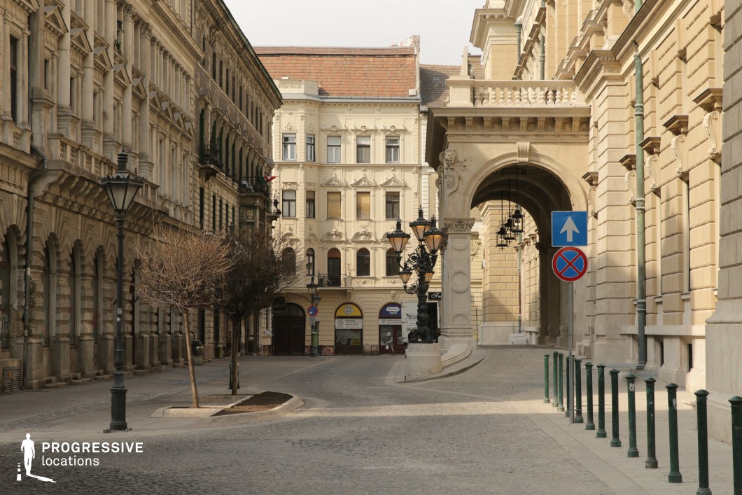 Historic arcade street with neoclassical facades creates an ideal film and photography location in a refined city setting.