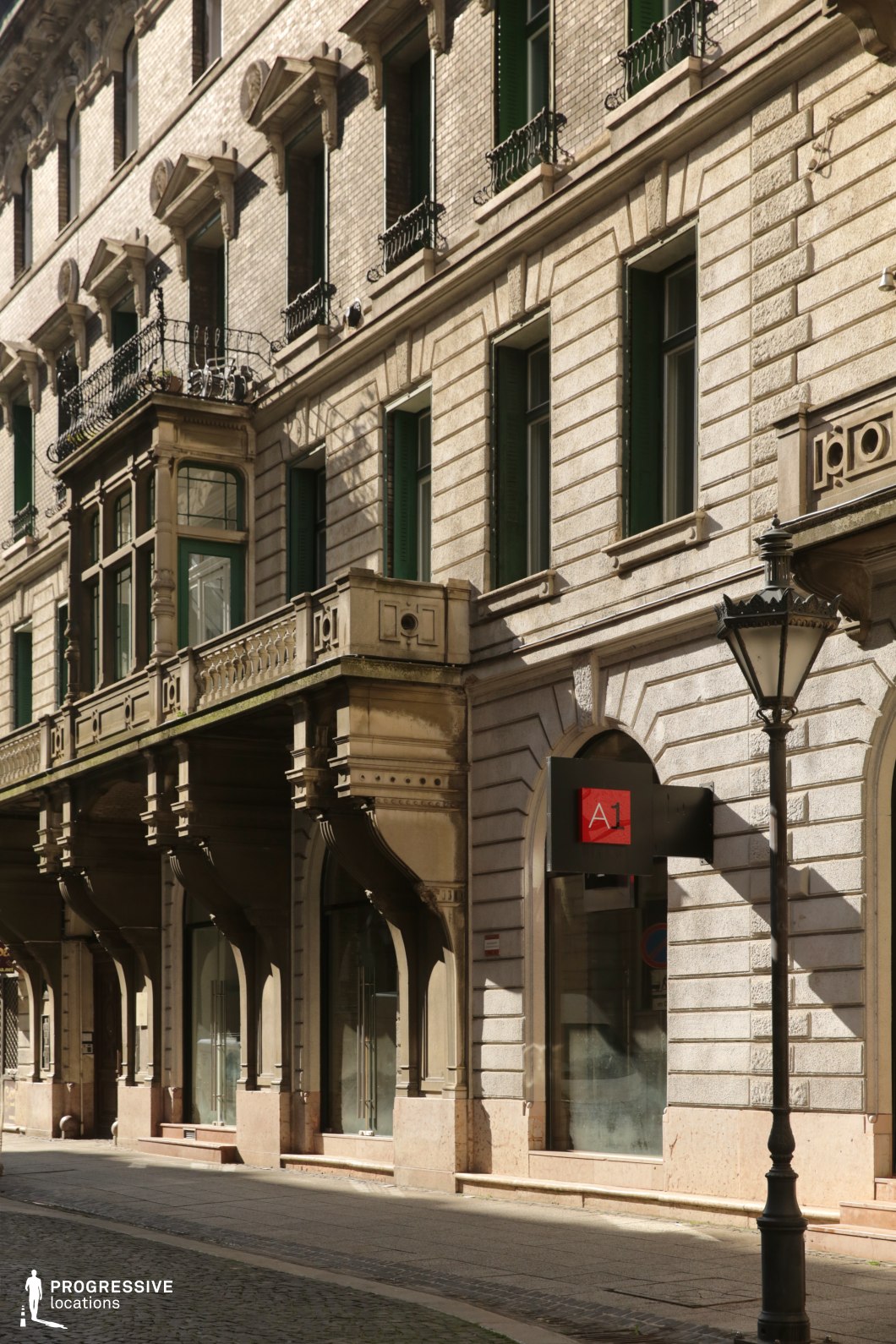 Historic stone facade with balconies creates an ideal location for photography and filming in an elegant city street.