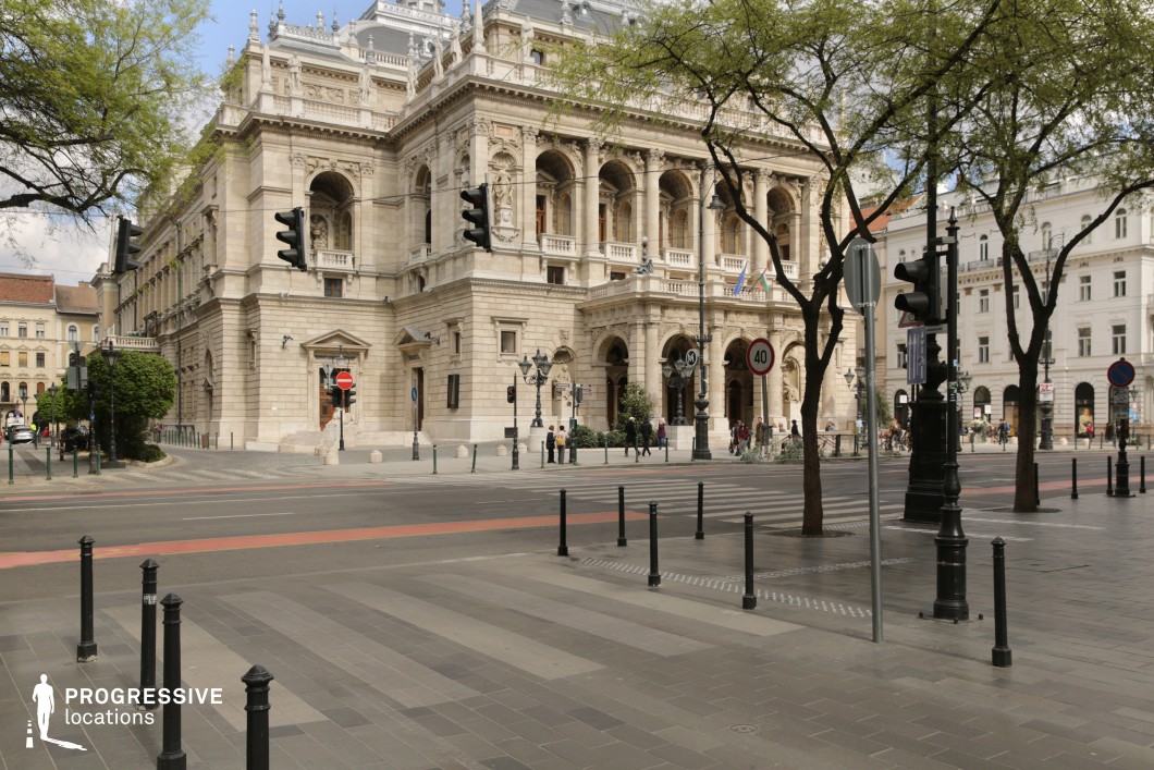 Historic opera house and wide boulevard create an ideal location for photography and filming in a grand urban setting.