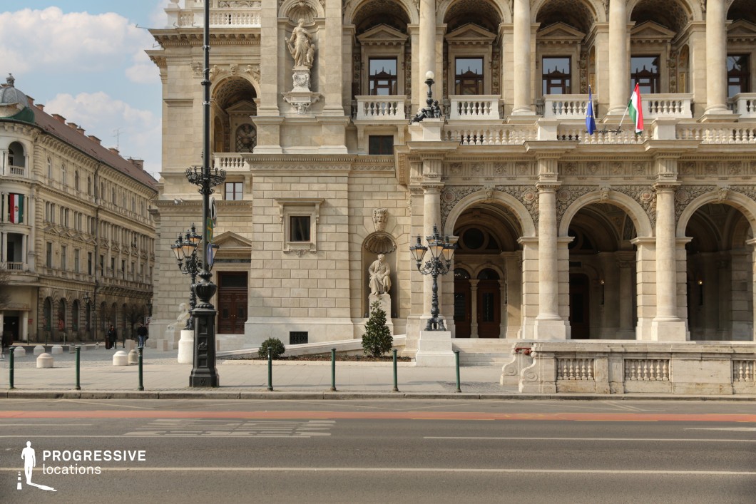 Ornate stone facade with arches and columns featured as a photography and film location in a historic city setting.