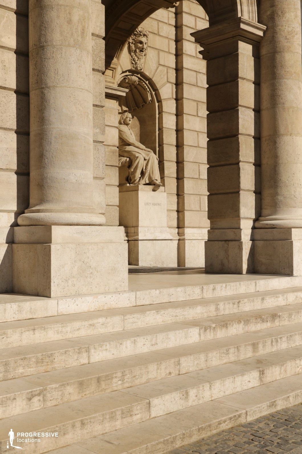 Monumental stone staircase and arches create a photography and film location with formal neoclassical character.