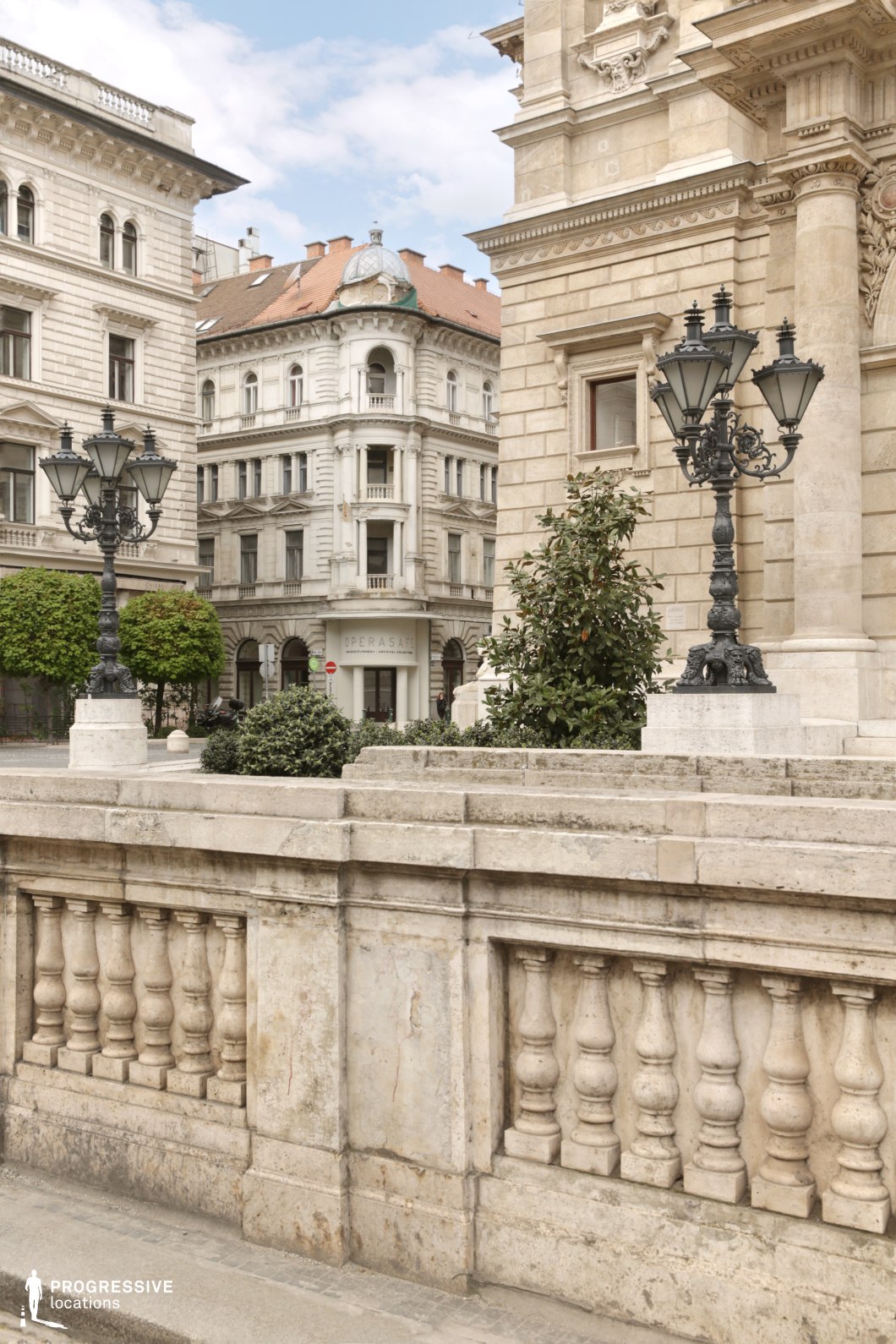 Historic stone terrace and neoclassical architecture create a film and photography location with formal urban character.