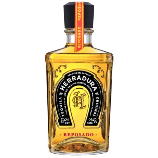 Herradura Tequila Reposado - 1.75L - Herradura Reposado is aged for eleven months, nine months longer than the industry standard. Its deep copper color and rounded taste sets our Reposado apart, along with its signature aroma of spices. The tastes of vanilla, butter and agave work in unison to create a smooth and sweet experience.