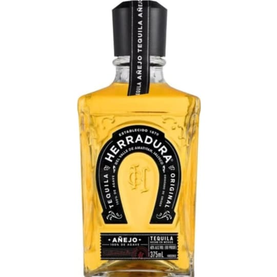 Herradura Añejo Tequila - 375mL - Since 1962 Herradura has been proud to offer this delicious aged tequila. Barrelling for two years in oak (twice as long as suggested by the category standards) gives it both a deep amber color and complex taste of cooked agave and dried fruit.