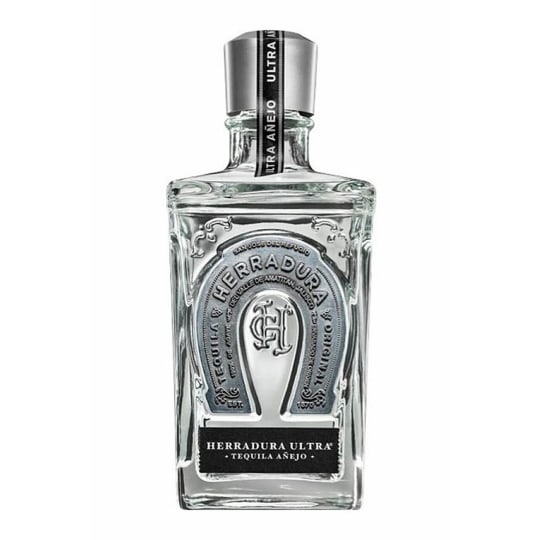 Herradura Ultra Añejo Tequila - 750mL - The crisp taste starts with one of Herradura's finest añejos, filtered to remove color and enhance smoothness. Full-bodied yet with subtle hints of agave nectar, caramel, vanilla, wood and dried fruit, it has a distinct flavor that's sure to elevate any high-energy occasion.