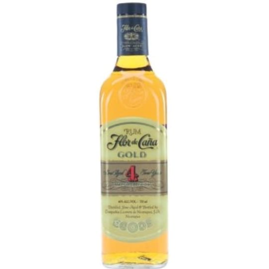 Flor de Caña 4 Year Aged Gold Rum - 750mL - A 4-year old premium dark rum with no added sugar, that is medium-bodied with a golden amber color. This rum has aromas of fresh vanilla bouquet with flavors of toasted coconut and wood, and a refreshing, dry finish. Best enjoyed with soda or sparkling water, or in punches and tropical cocktails.