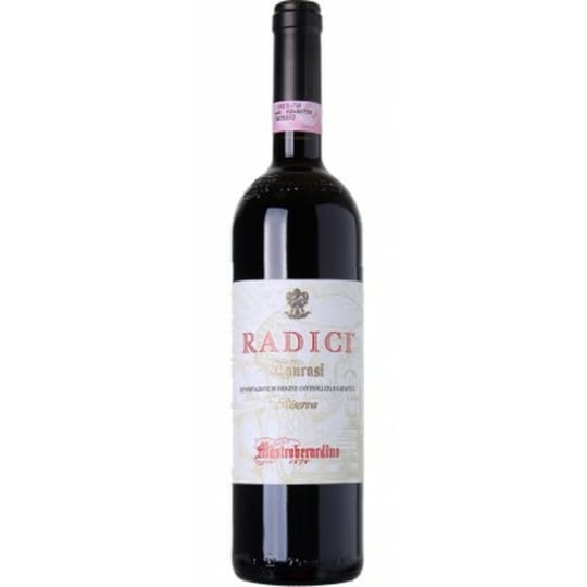 Mastroberardino Taurasi Riserva 2014 - 750mL -  First produced in 1986, the Radici Taurasi Riserva is the result of painstaking research into the chemical and physical characteristics of the Montemarano vineyard. The idea was to fully understand the environment in which the roots (or "radici" in Italian) grow. This sets the benchmark for Aglianico in southern Italy. Made from 100% Aglianico grapes and is aged in oak for 30 months, with an additional aging of 48 months in the bottle to give it a refined and elegant taste. Deep ruby-red in color, complex and intense aromas of black fruits and tobacco complement undertones of cherries and plum skins. On the palate, the Radici Taurasi Riserva is enveloping, elegant, and persistent, with a long finish of blueberries and mulberries. Pair this wine with paccheri with ragu alla napoletana, pork shoulder with chestnuts and olives, and meatballs braised in tomato sauce.