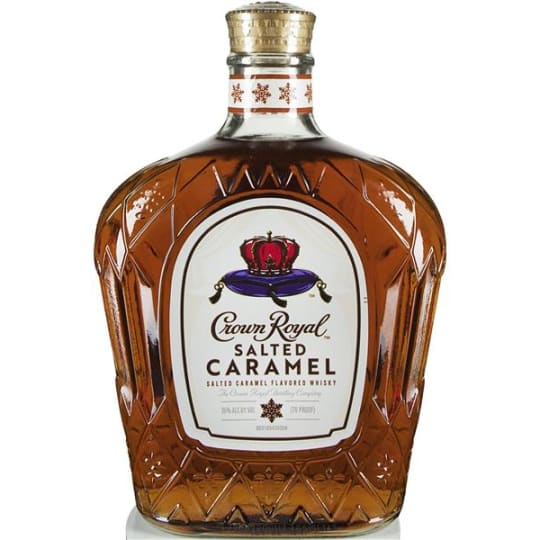 Crown Royal Salted Caramel Flavored Whisky - 750mL - Unwind in luxury with a glass of Crown Royal Salted Caramel Flavored Whisky. With notes of indulgent salted caramel and the scent of vanilla oakiness that impart lush creaminess, our 70 proof whisky provides a refined and rich flavor. Made with the signature smoothness of traditional Crown Royal, our whisky is matured to perfection and will enhance any cocktail party or celebration. Simply mix with Crown Royal Regal Apple Flavored Whisky for a refreshing Candy Apple cocktail. First created in 1939 as a gift for the king and queen of England, a Canadian entrepreneur created a blend of 50 whiskies and wrapped a bottle in a regal purple bag with gold stitching. Affectionately named "Crown Royal", our whisky maintains the integrity and quality of our process today as it was first presented to English royalty. Blended with 50 distinct whiskies, Crown Royal assures decadence in every bottle of our signature whiskies. Please drink responsibly.