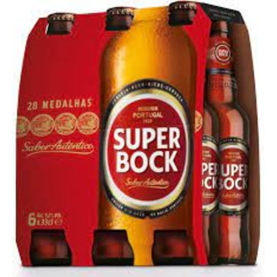 Super Bock 6 Pack 12oz Bottles - From Portugal, 5.4% ABV. Clear, pale golden straw color. Dry grain and fruity ester aromas with undertones of lemon. Grainy flavors with hints of citrus, grapes and lemon, balanced by a bitter hop note. Sweet malts add a balancing texture to the palate.