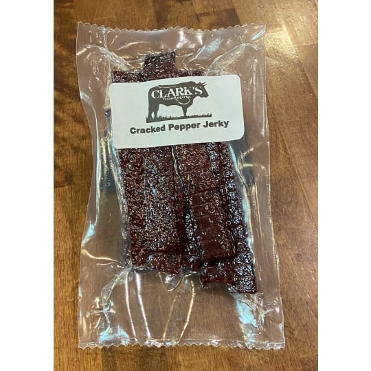 Cracked Pepper Processed Jerky - Our processed jerky uses ground and pressed beef into strips with a whole lot of flavor. Smoked in house. Coated with black pepper.  Ordered in 0.5 lb increments. For example, if you order a quantity of 2, you will receive 1 lb.   Price per pound is $22.99.