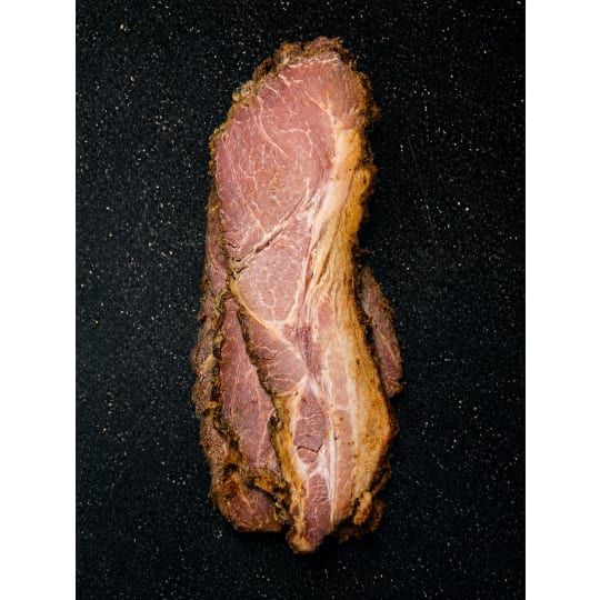 Smoked Pork - Pork shoulder smoked to perfection with our favorite locally sourced BBQ rub. Sliced and ready for a bun. Serve with your favorite baked potato and mac & cheese recipe.