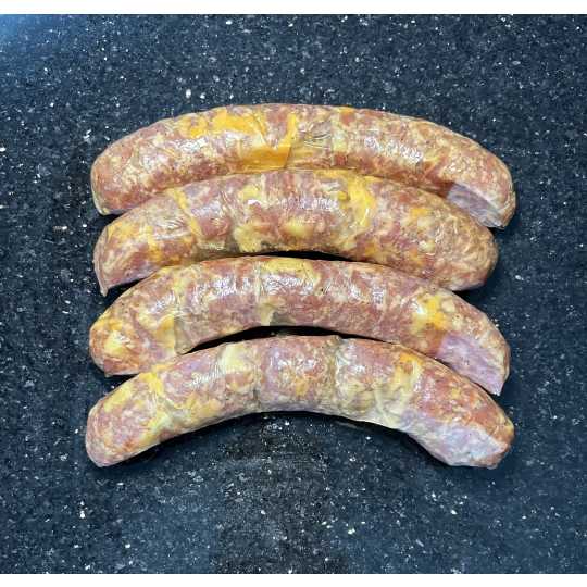 Mac N Cheese - Smoked and fully cooked brat. Just warm them up and they are ready for dinner! This one is sure to please the kids!  Ordered in 1 lb increments. For example, if you order a quantity of 2, you will receive 2 lb.   Price per pound is $12.49.