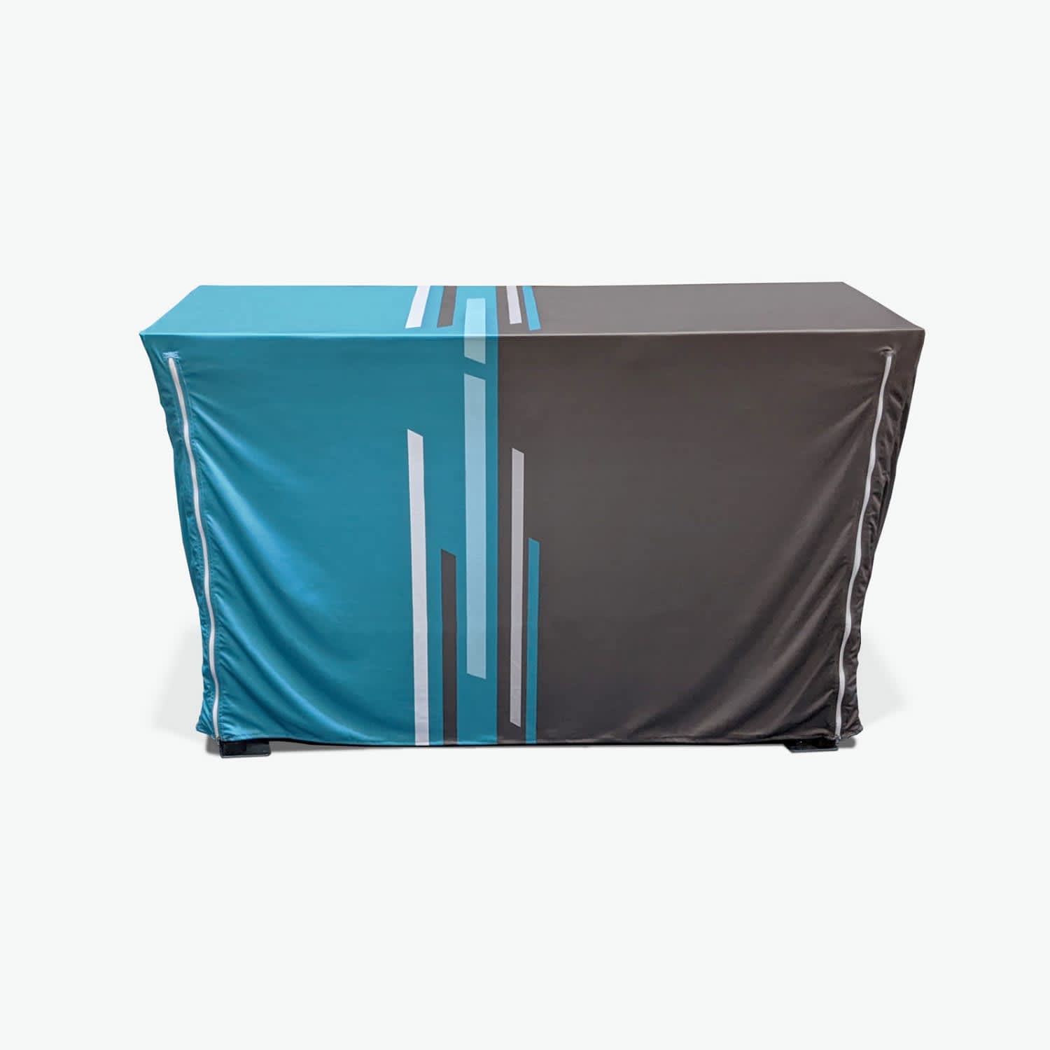 A tablecloth featuring a geometric design in shades of blue and grey, fitted for a small table.