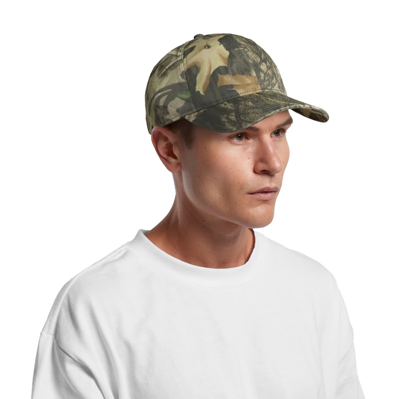 Access Camo Cap AS-1130C A camo cap in shades of green and brown, featuring a curved brim and a logo on the side, worn by a man.