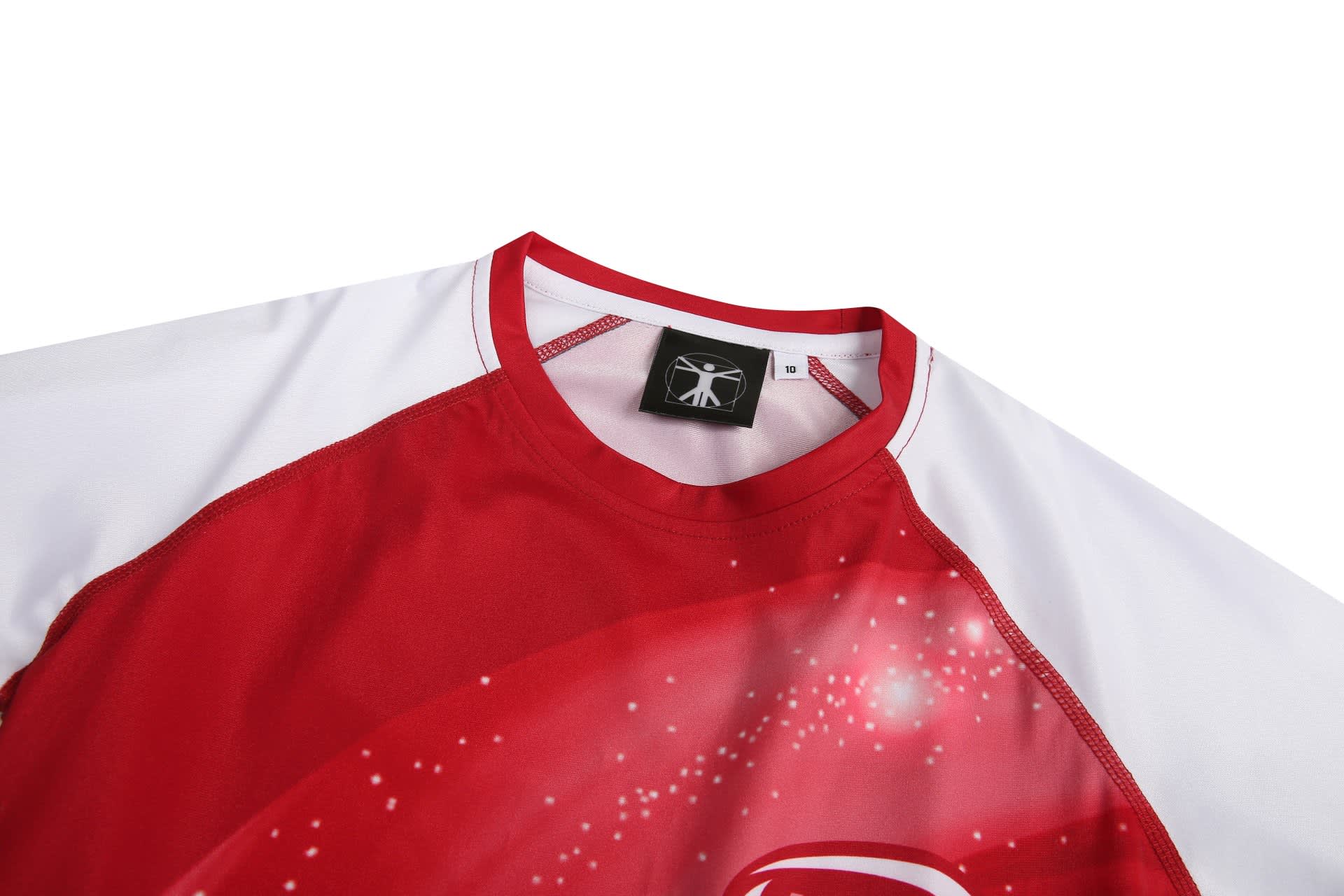 A red and white women's swim shirt featuring a graphic design and a logo on the collar.