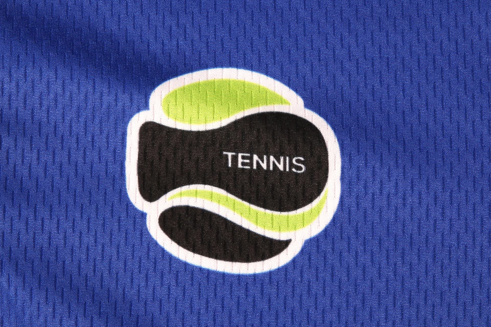 A blue tennis team uniform featuring a logo with a black and green tennis motif.