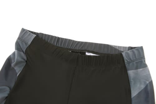 A cycling uniform in dark green with grey detailing, featuring a comfortable elastic waistband and a sleek design.