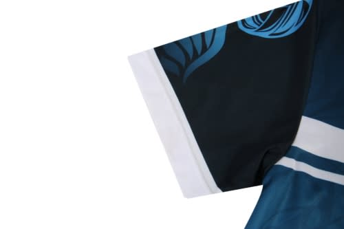 A volleyball uniform featuring a dark blue and black design with decorative patterns on the sleeve. It has a logo.
