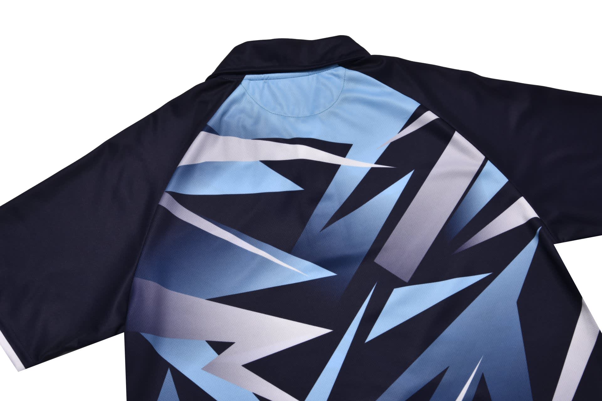 A polo shirt featuring a striking blue and grey geometric design, with a collar and short sleeves. It has a logo.